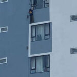 シハヌークビル　ラオス人女性が高層ビルからぶら下がる、通報で救助